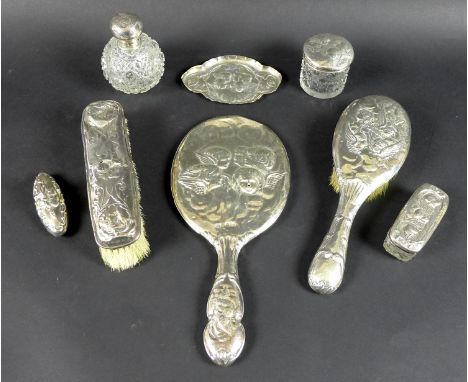 A Victorian and Edwardian silver dressing table set comprising hand mirror, hair brush, clothes brush, pin tray, scent bottle