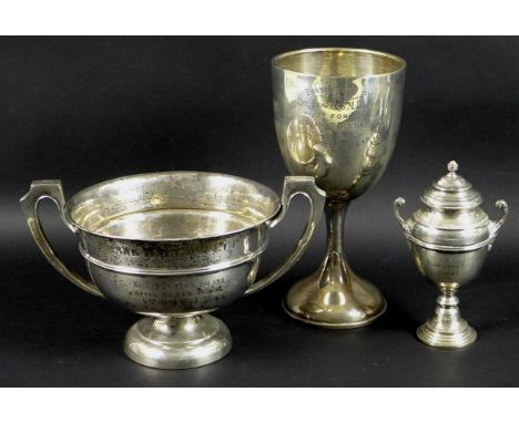 A group of three Edwardian silver sporting trophies awarded to Tom Morton, comprising a twin handled trophy, engraved 'Frank 