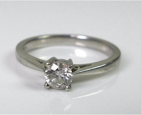 A platinum and diamond solitaire ring, the diamond approx 0.25ct, size K 1/2, 3.7g. 
