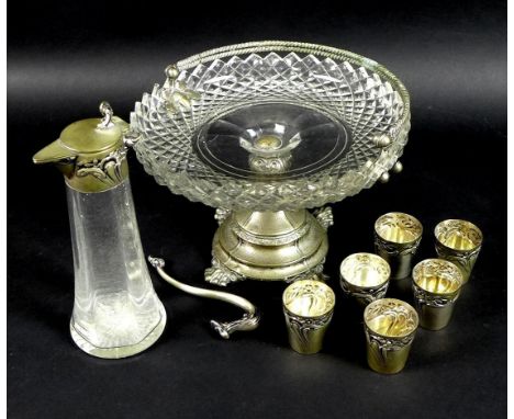 An early 20th century Continental silver liqueur decanter with six matching silver cups, all chased and embossed with Art Nou