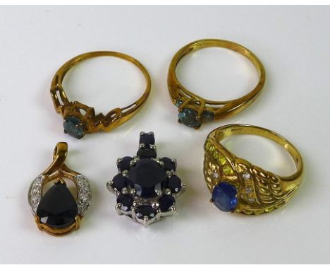 A group of 9ct gold jewellery, comprising a sapphire pendant, a sapphire and diamond dress ring, size N, a further sapphire a