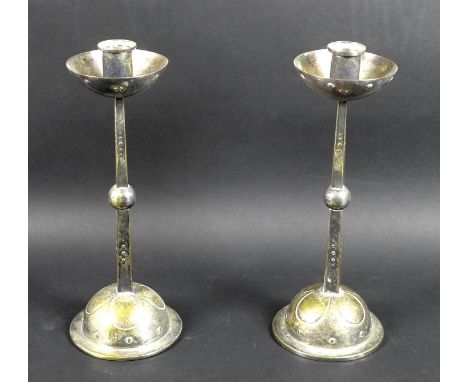 A pair of WMF Jugendstil silver plated on brass Arts & Crafts candlesticks, circa 1915, with hemispherical drip trays on slen