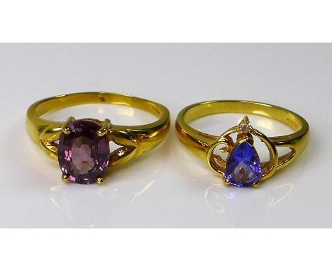 An 18ct gold dress ring set with diamonds and a pear cut tanzanite, size N, together with an 18ct gold dress ring set with a 