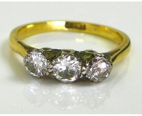 An 18ct gold three stone diamond ring, approx 0.5ct total diamond weight, size K, 2.4g. 