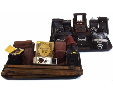 Collection of thirteen vintage cameras by Kodak, Koroll, bell and Howell, Konica and other makers also an Ilford Bookr, and t