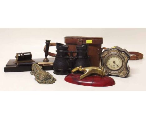 Silver pounted clock, desk stand, war issue binoculars, paper clip and a paper weight in the form of a hand Condition report: