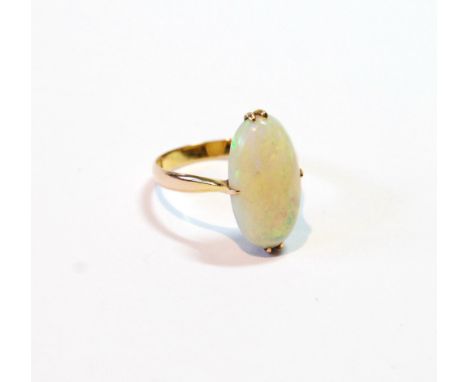 Ring with oval opal, claw-set in gold, '18k'.   Condition Report  Size M