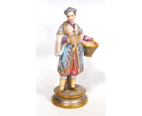 Meissen style porcelain figure of a Chinaman selling flowers, on a circular base, marked 'D&T/L 2572', underglaze blue crosse