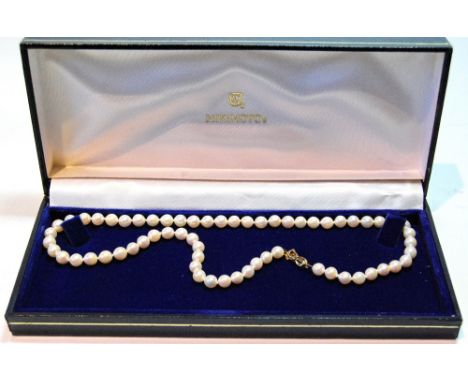 Mikimoto single strand necklace of sixty-three cultured pearls on 9ct Mikimoto snap, with box and leaflet, 1991.