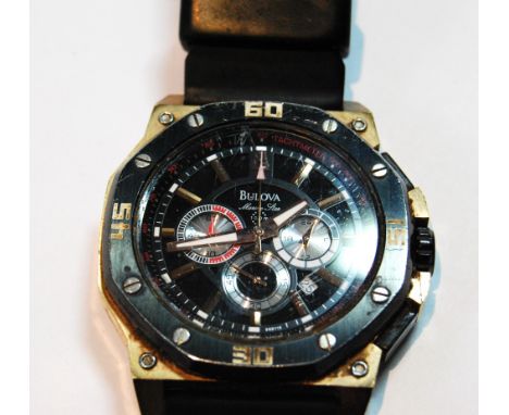 Gent's Bulova Marine Star quartz watch with gilt and black anodised case, on strap, with box and leaflet.