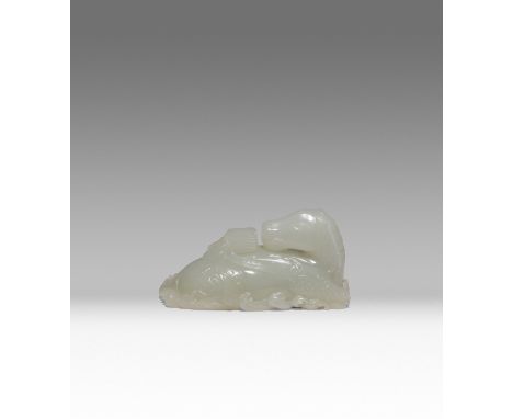A CHINESE PALE CELADON JADE CARVING OF A LONG MA QING DYNASTY OR LATER The recumbent scaly horse supported by crashing waves,