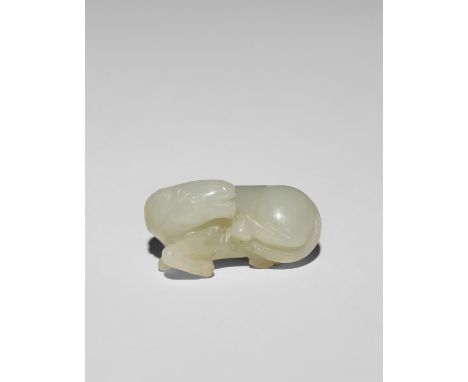 A CHINESE PALE CELADON JADE CARVING OF A HORSE 18TH/19TH CENTURY The recumbent horse depicted with its head turned back towar