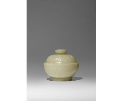 A CHINESE YELLOW JADE 'BAJIXIANG' BOWL AND COVER QING DYNASTY OR LATER Carved as a lotus flowerhead, the petals enclosing the