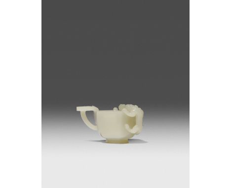 A CHINESE PALE CELADON JADE HEXAGONAL LIBATION CUP QING DYNASTY OR LATER With two chilong clambering over the rim, the handle