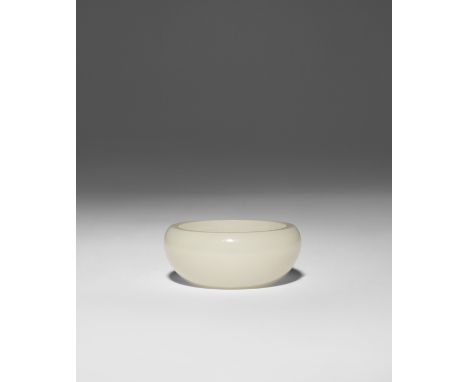 A SMALL CHINESE PALE CELADON JADE BRUSH WASHER QING DYNASTY OR LATER The plain circular body with an inverted rim, the base w