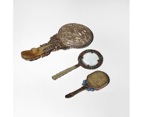 TWO CHINESE JADE AND SILVER MOUNTED MIRRORS AND A MAGNIFYING GLASS QING DYNASTY/REPUBLIC PERIOD Two set with celadon jade han