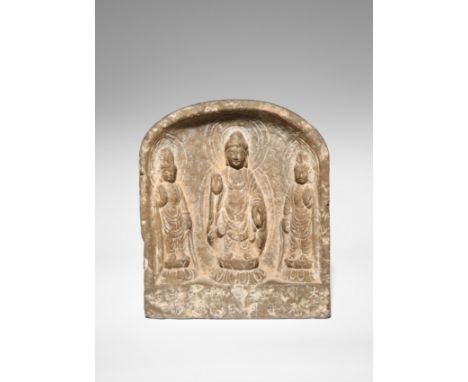 A CHINESE GREY LIMESTONE BUDDHIST STELE TANG DYNASTY DATED 717 AD Carved in high relief with Buddha Shakyamuni at the centre,