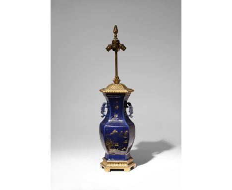 A CHINESE GILT-DECORATED BLUE-GROUND VASE QING DYNASTY The hexagonal body decorated with a landscape to one side, and a panel