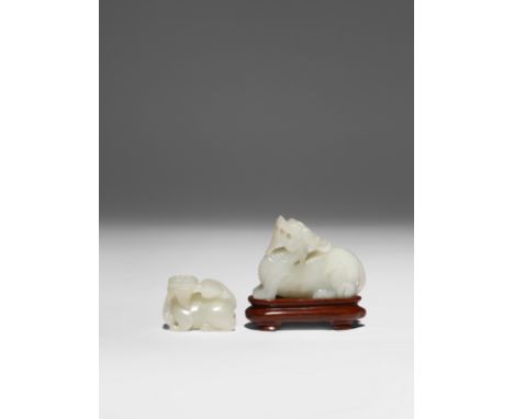 TWO SMALL CHINESE PALE CELADON JADE CARVINGS OF PIXIU QING DYNASTY The larger female beast crouching with her head raised, th