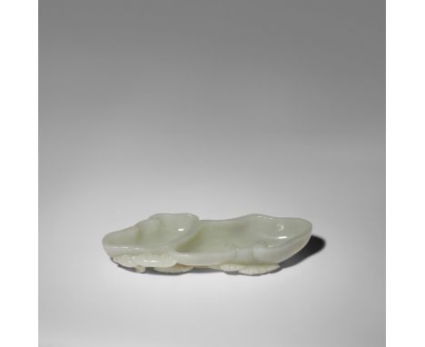 A CHINESE PALE CELADON JADE 'LINGZHI' WASHER QING DYNASTY OR LATER Carved in the form of two large heads of a lingzhi fungi, 
