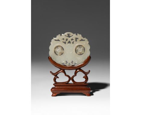 A CHINESE PALE CELADON JADE RETICULATED 'BUTTERFLY' PLAQUE QING DYNASTY Carved on each side as a butterfly with openwork ante
