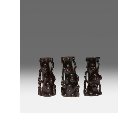 THREE CHINESE ZITAN INCENSE STICK HOLDERS 17TH/18TH CENTURY Carved as knotty tree stumps, one with a three character mark whi