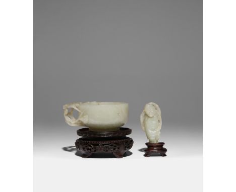 A CHINESE PALE CELADON JADE CUP AND A JADE FIGURE OF LIU HAI QING DYNASTY The cup with a single openwork handle (originally w