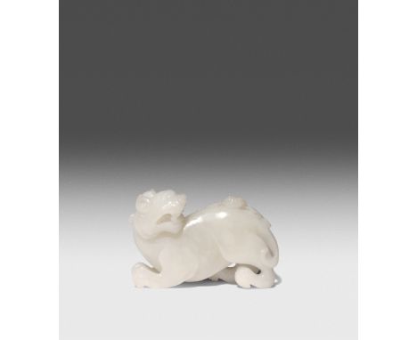 A CHINESE WHITE JADE FIGURE OF XIEZHI QING DYNASTY OR LATER The beast depicted in a recumbent pose, gazing at the bat perched
