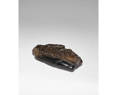 A CHINESE BLACK AND CELADON JADE CARVING OF XUANWU PROBABLY MING DYNASTY The mythical turtle with a single horn, bifurcated t