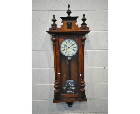 A 19TH CENTURY WALNUT VIENNA REGULATOR WALL CLOCK, with turned finials, the seven inch enamel dial with Roman numerals and se