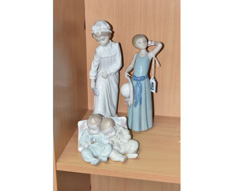 THREE LLADRO AND NAO FIGURES, comprising Coiffure Girl with Straw Hat, model no 5010, sculptor Francisco Catala, issued 1978-