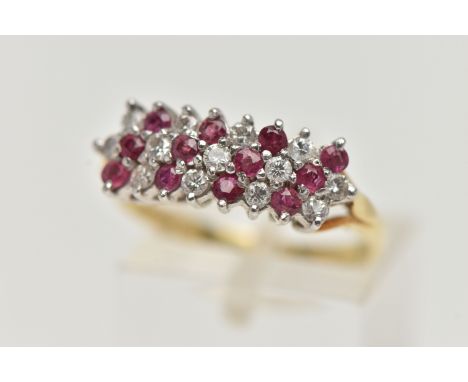 AN 18CT GOLD RUBY AND DIAMOND CLUSTER RING, designed as three rows of alternating round brilliant cut diamonds and circular c