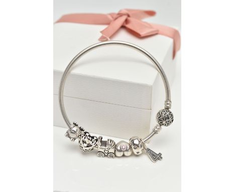 A BOXED 'PANDORA' CHARM BRACELET, polished bangle fitted with a textured hinged ball clasp, stamped S925 ALE, with six charms