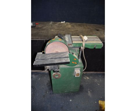 A TM BELT AND DISC GRINDER, on stand with 6in belt width and 9in disc overall height 97cm (PAT fail due to uninsulated plug b
