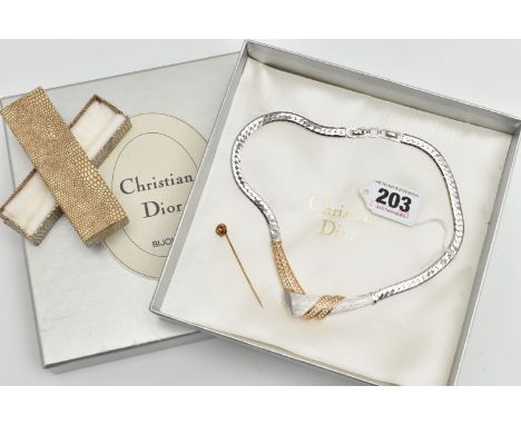 A 'CHRISTIAN DIOR' NECKLACE AND YELLOW METAL STICK PIN, a bi colour necklace with a cross over design, set with colourless pa