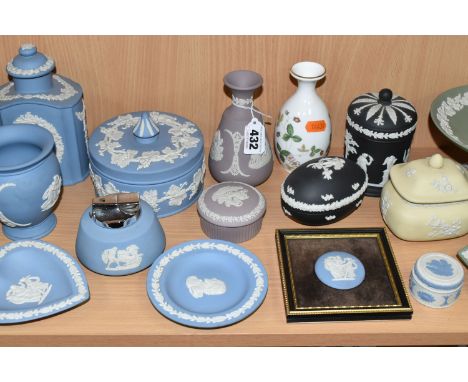 A COLLECTION OF WEDGWOOD JASPERWARE, comprising a pale lemon Prunus design trinket pot, two black trinket boxes, a lilac trin