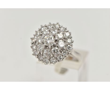 A WHITE METAL DIAMOND CLUSTER DRESS RING, circular cluster of round brilliant cut diamonds, centre stone approximately 0.30ct