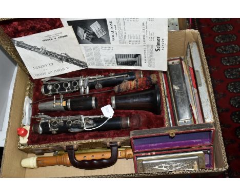 A BOX OF MUSICAL INSTRUMENTS, comprising a Boosey &amp; Hawkes Emperor clarinet in fitted case, Hohner Larry Adler Profession