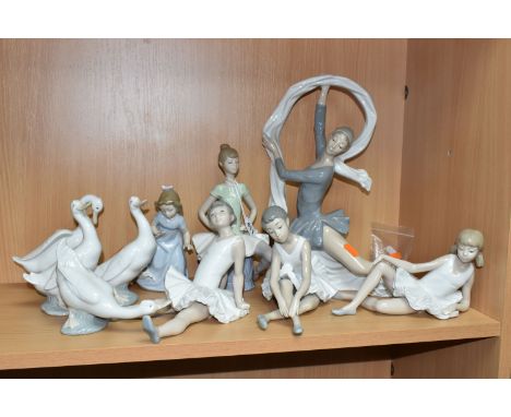 A LLADRO FIGURE AND NINE NAO FIGURES, comprising Lladro 'Laura' seated ballerina figure, model no 1360, sculptor Juan Huerta,