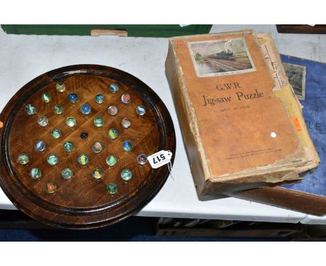 A WOODEN BAGATELLE BOARD, complete with marbles, appears in fairly good condition with only minor marking and wear, with two 