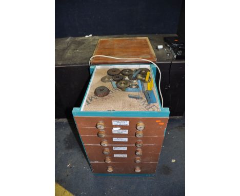 A WOODEN CHEST OF SIX DRAWERS, containing milling and lathe cutters, measuring equipment, deburring tools, chucks, mandrills,