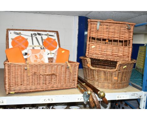 A GROUP OF WALKING STICKS AND WICKER ITEMS, to include five walking sticks: one with a brass ball and talon style handle, ano