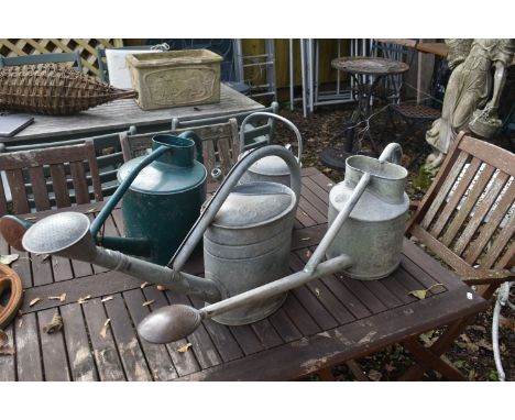 THREE VINTAGE GALVANISED WATERING CANS, one labelled HAWS of Stourbridge, another stamped BAT, and a metal watering can (4)