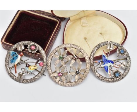 THREE OPEN WORK BROOCHES, the first a circular form brooch with floral detail, an enamel detailed stork to the centre of the 