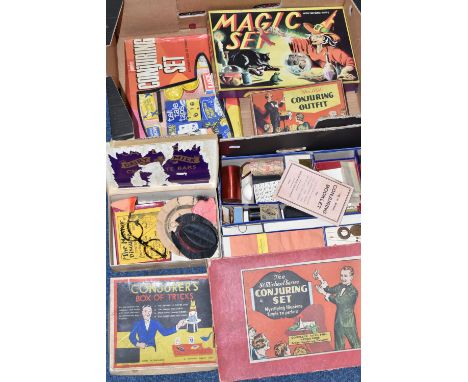 ONE BOX OF VINTAGE MAGIC SETS, dating from the 1920s onwards, to include a Conjurer's Box of Tricks, The St Michael Series Co