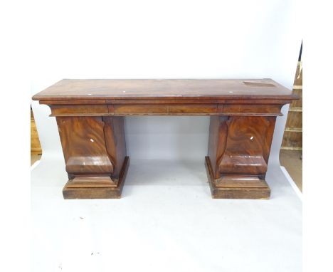 A Regency flame veneered mahogany twin-pedestal sideboard, with raised shaped back, fitted with 3 frieze drawers and panelled