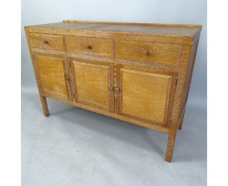 A 1930s Heals design limed oak sideboard, with fitted drawers and cupboards, 130cm x 88cm x 47cm 