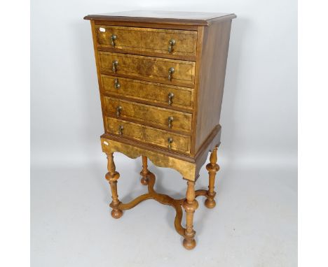 A reproduction burr-walnut and ebony-strung 1-section chest on stand/music cabinet, having 5 fall-front drawers, 50cm x 108cm