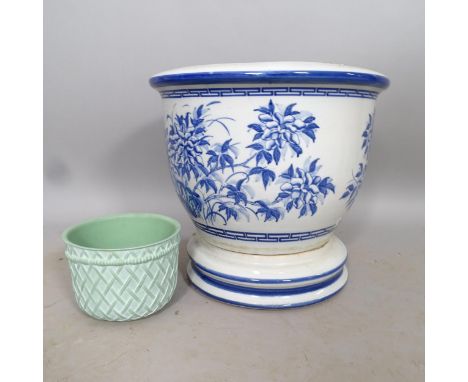 A blue and white ceramic planter on stand, 47cm x 44cm 