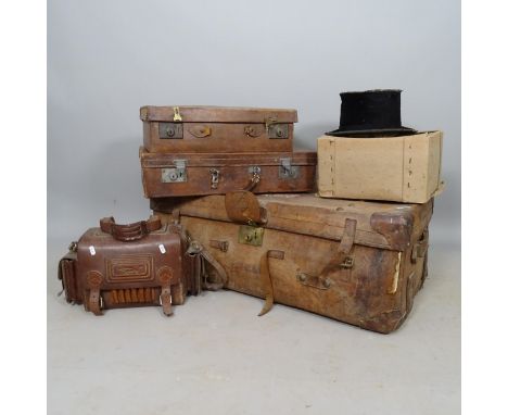 An Antique leather trunk, 2 leather suitcases, cartridge bag, and top hat (A/F) (5) 